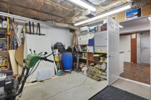 a garage interior with tools and storage items